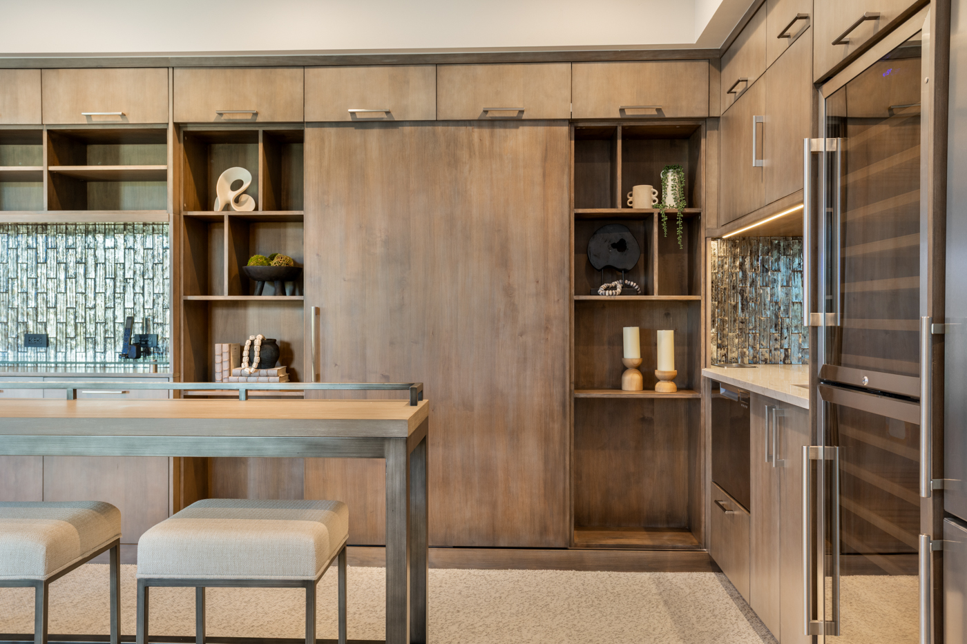 Wet bar cabinetry detail with glass tile backsplash and open shelving