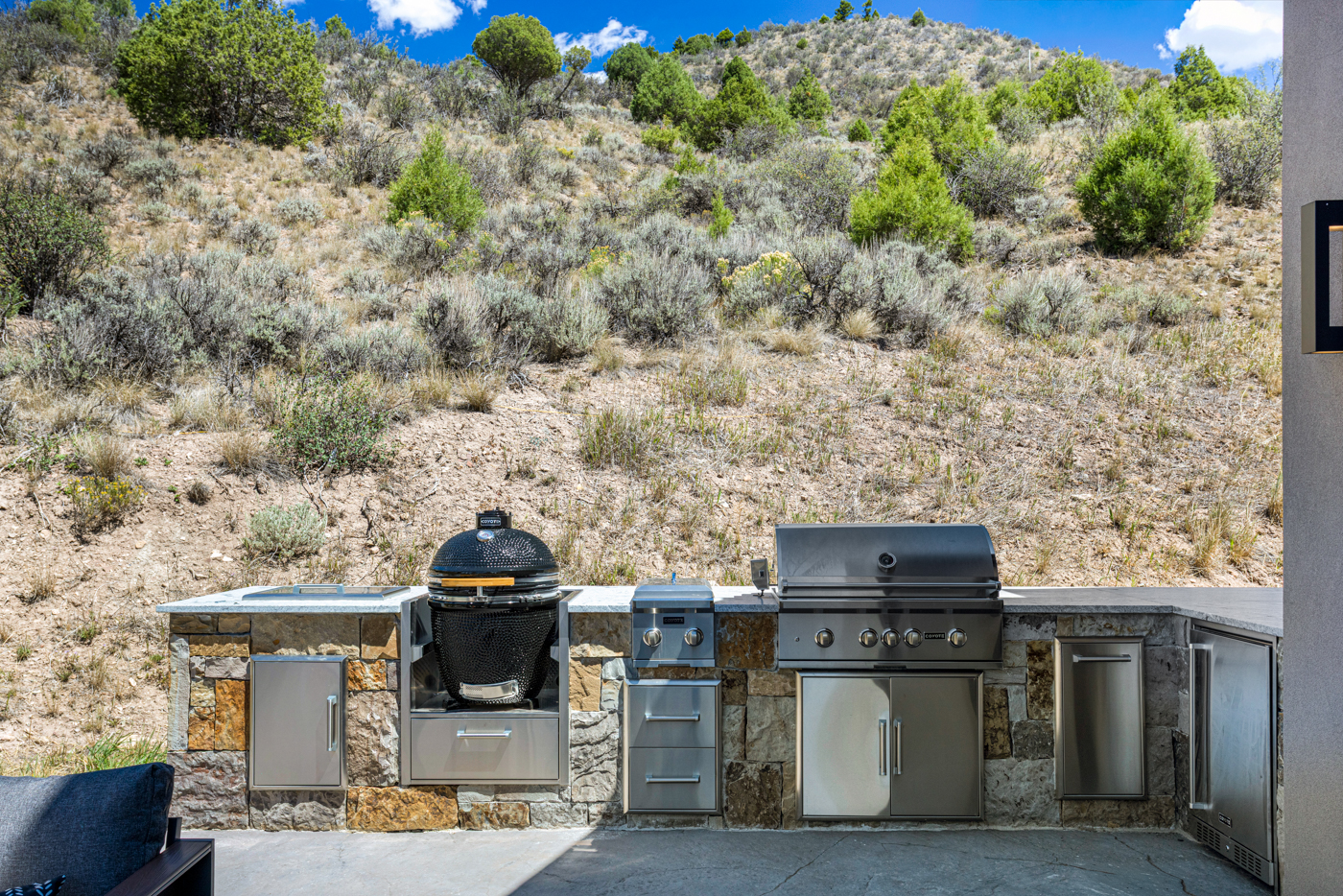 Outdoor kitchen with grill and smoker