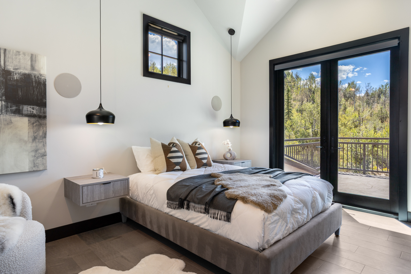 Guest bedroom opening to a private deck