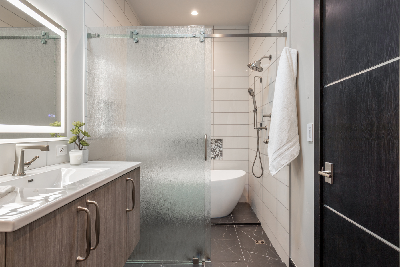 Guest bath with freestanding tub and rain shower