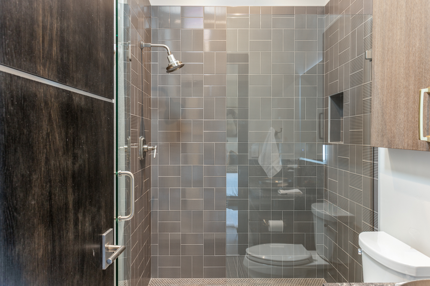 Ensuite bath with fully tiled glass shower