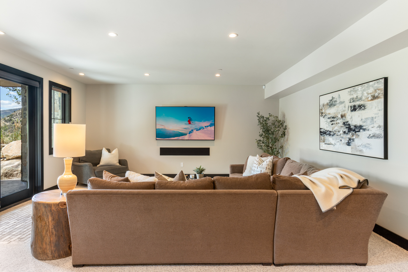 Family room with patio doors framing mountain glimpses