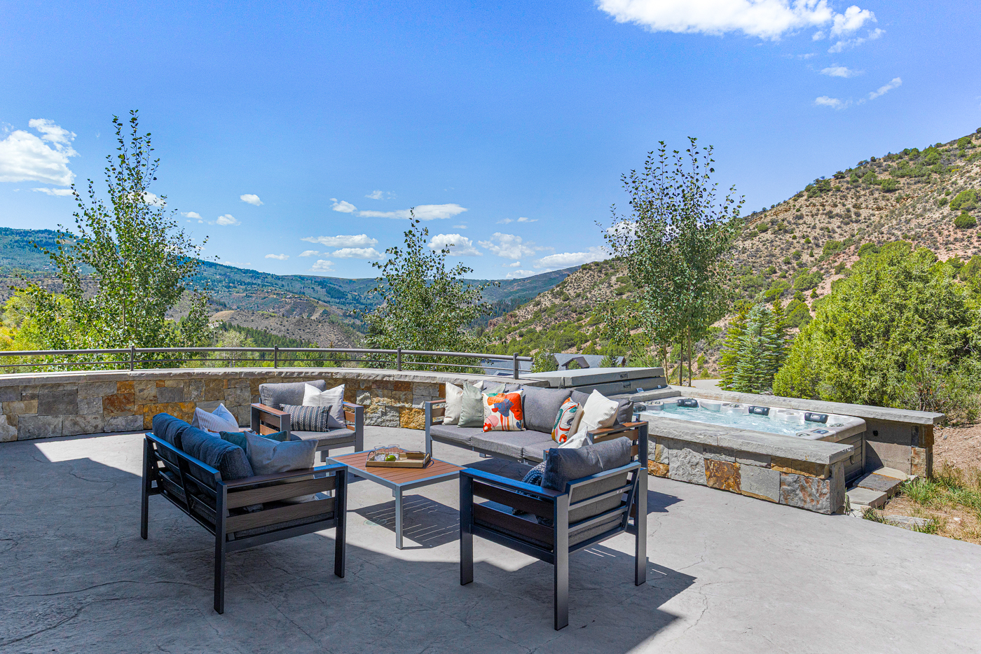 Patio lounge and hot tub with valley views