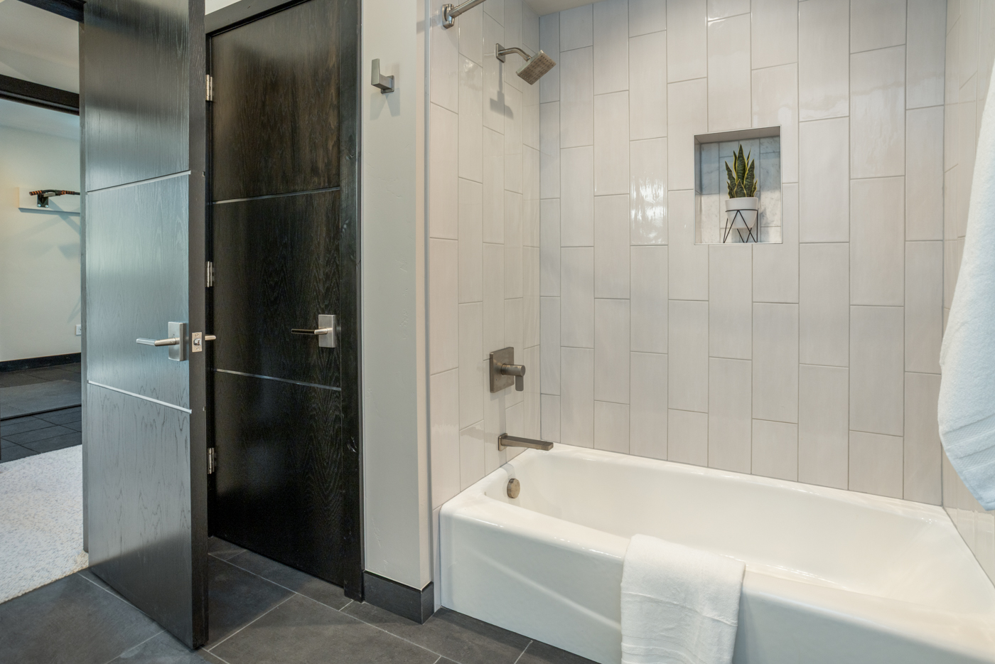 Tub and shower with vertical tile surround